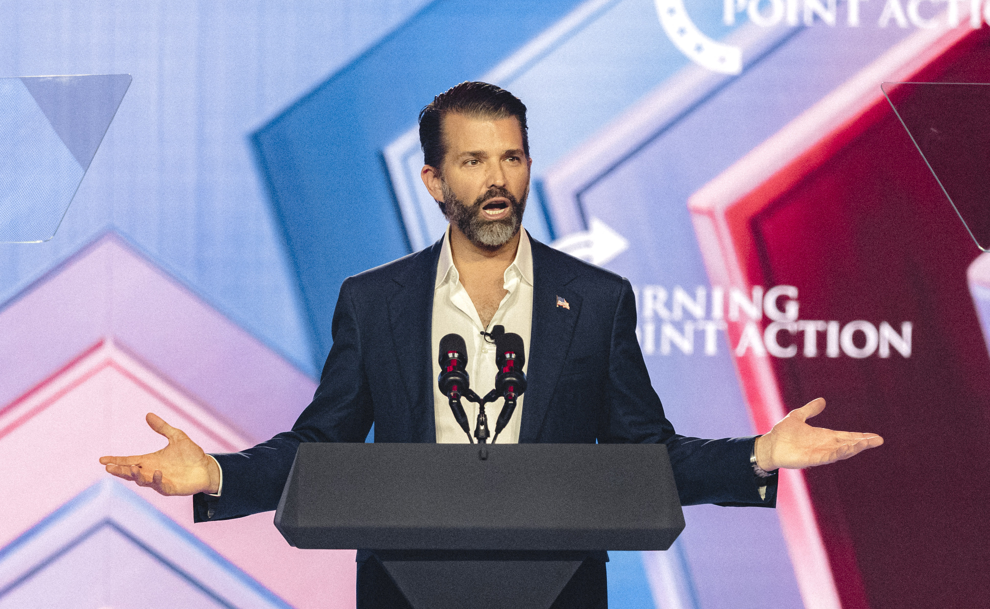 Donald Trump Jr. speaks on stage during Turning Point's annual AmericaFest conference in Phoenix, Arizona on December 21, 2025.