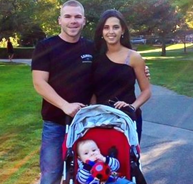 Michael Leavitt, Bruna Ferreira, and their son in an undated image posted to social media.