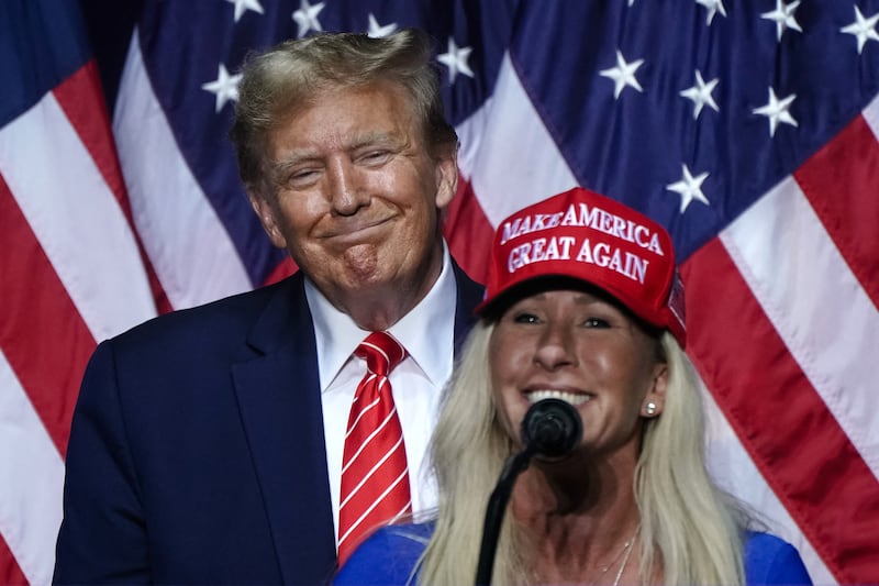 Marjorie Taylor Greene (R) speaks alongside Donald Trump at a campaign event in Rome, Georgia, on March 9, 2024.