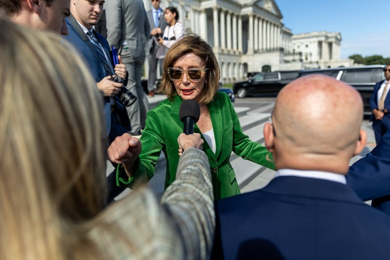 WASHINGTON, DC - OCTOBER 15: Speaker Emerita Nancy Pelosi (D-CA) responds to a question following a press conference on healthcare with other House Democrats on the East steps of the U.S. Capitol on the 15th day of the government shutdown in Washington, DC on October 15, 2025. (Photo by Nathan Posner/Anadolu via Getty Images)