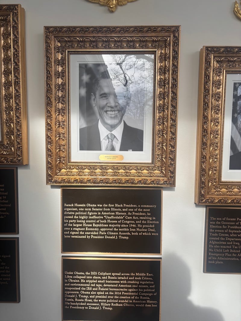 The new signage under the image of President Obama on Donald Trump's