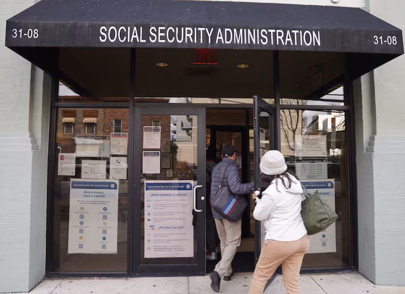 People step into an office of the Social Security Administration in New York
