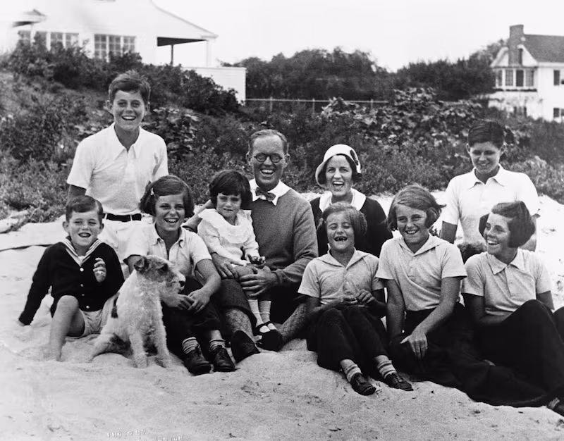 Joseph P. and Rose Kennedy pose for a picture on the beach at Hyannis Port, Massachusetts with their eight children. (Photo by © CORBIS/Corbis via Getty Images)