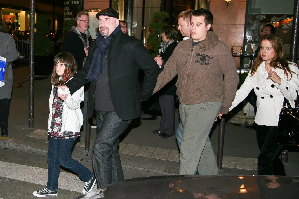 Actor John Travolta and his family, including daughter Ella Bleu, son Jett, and wife Kelly Preston, leaving a restaurant in Paris.