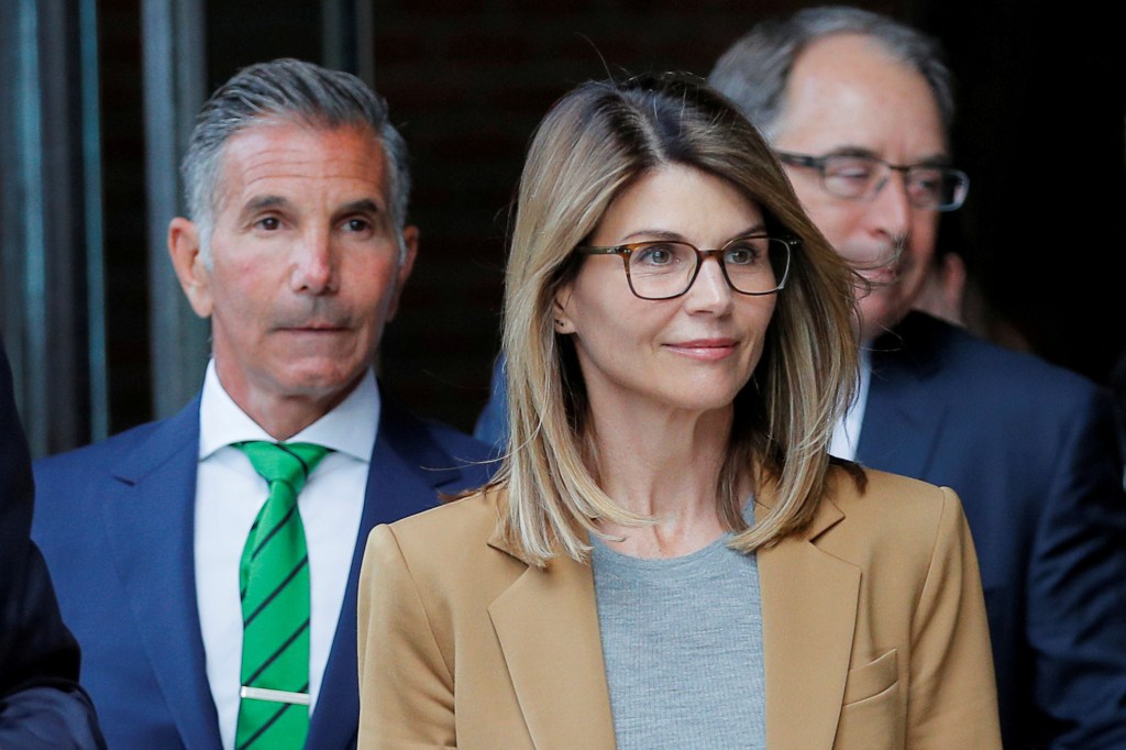 Actor Lori Loughlin and her husband Mossimo Giannulli leaving a federal courthouse.