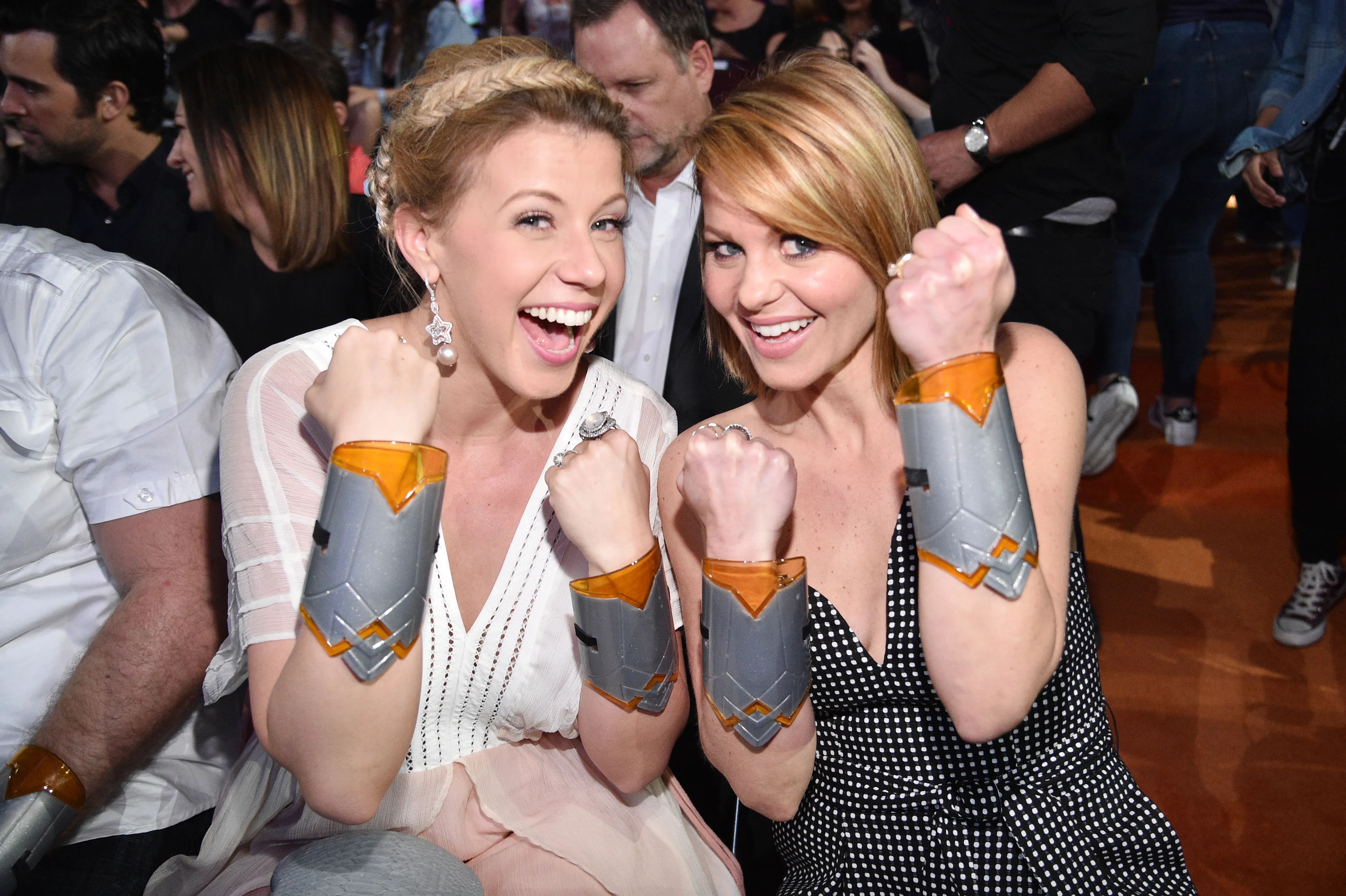 Jodie Sweetin and Candace Cameron Bure pose as Wonder Women.