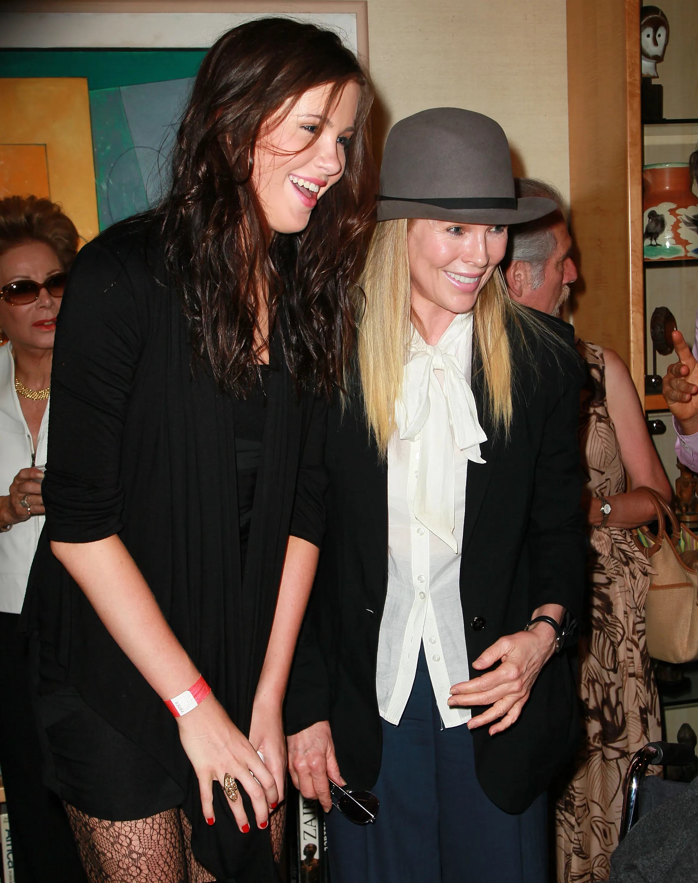 Kim Basinger and daughter Ireland Baldwin at an art exhibit.