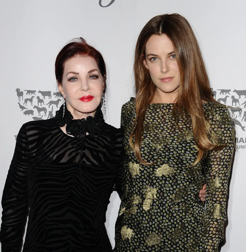 Actresses Priscilla Presley and Riley Keough posing for a photo.