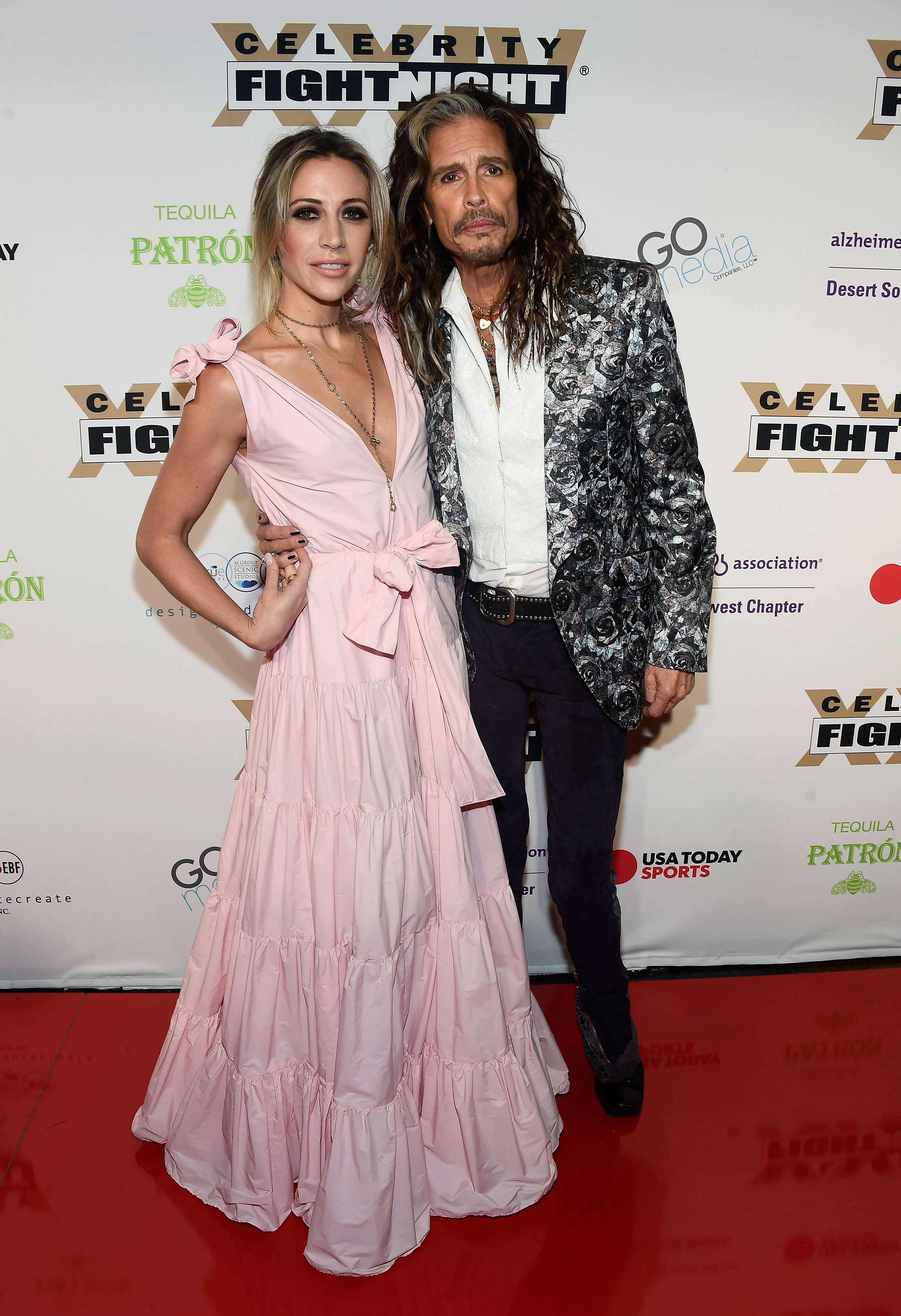 Aimee Preston and Steven Tyler posing at the Celebrity Fight Night XXIV red carpet.