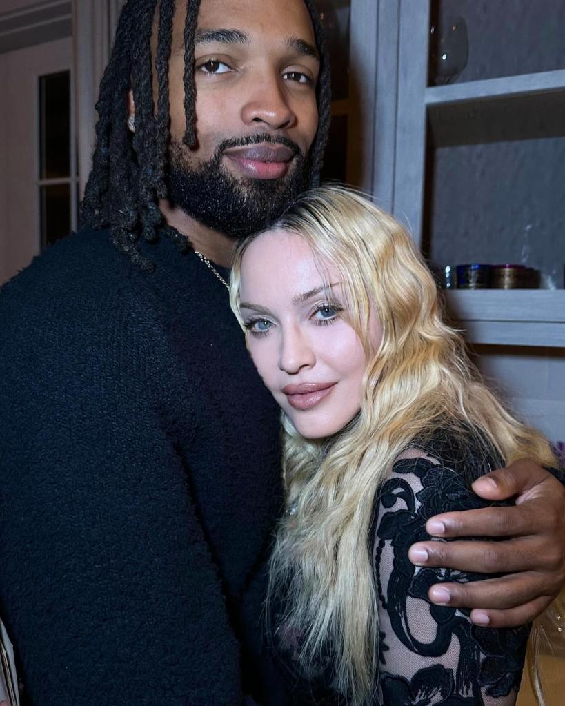 Akeem Morris and Madonna posing together.
