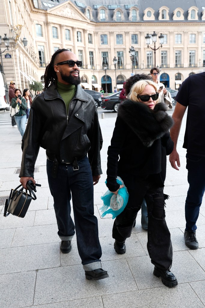 Akeem Morris and Madonna are seen on September 29, 2025 in Paris, France.