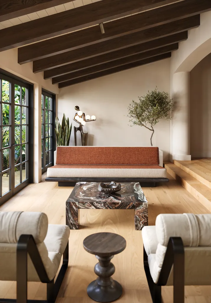 Beamed ceilings lend a cozy feel to the room, which is primed for entertaining