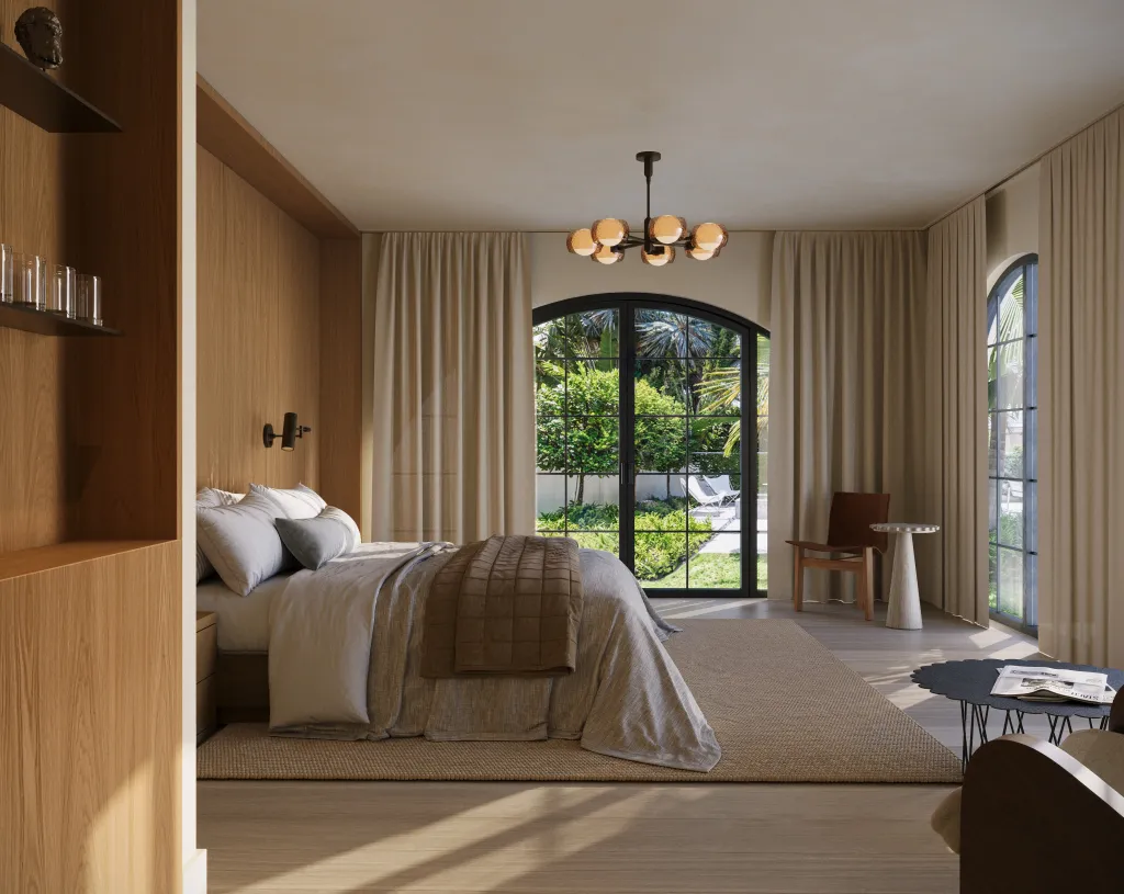 Bedroom with wood paneled walls, a large bed, and arched windows looking out to a garden.
