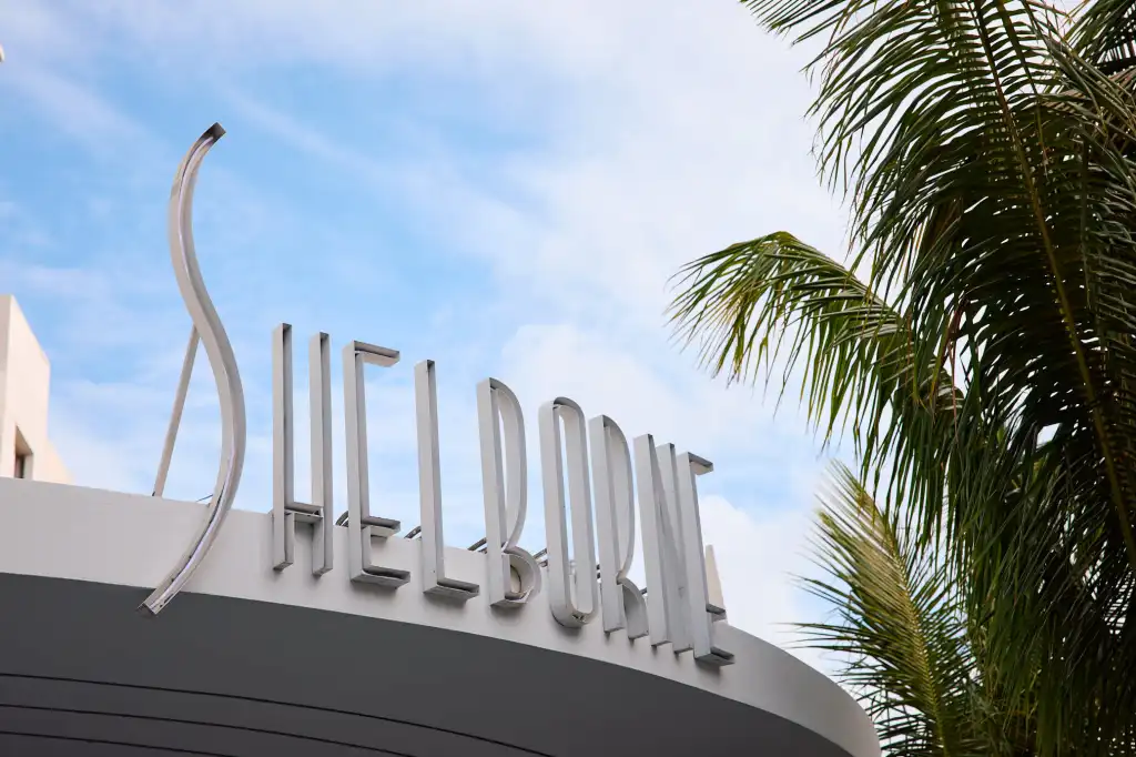 The Shelborne hotel sign with a palm tree on the right side.