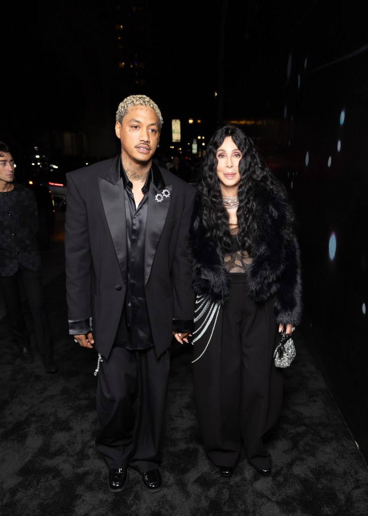 Alexander Edwards and Cher arriving at the Swarovski event in Hollywood.