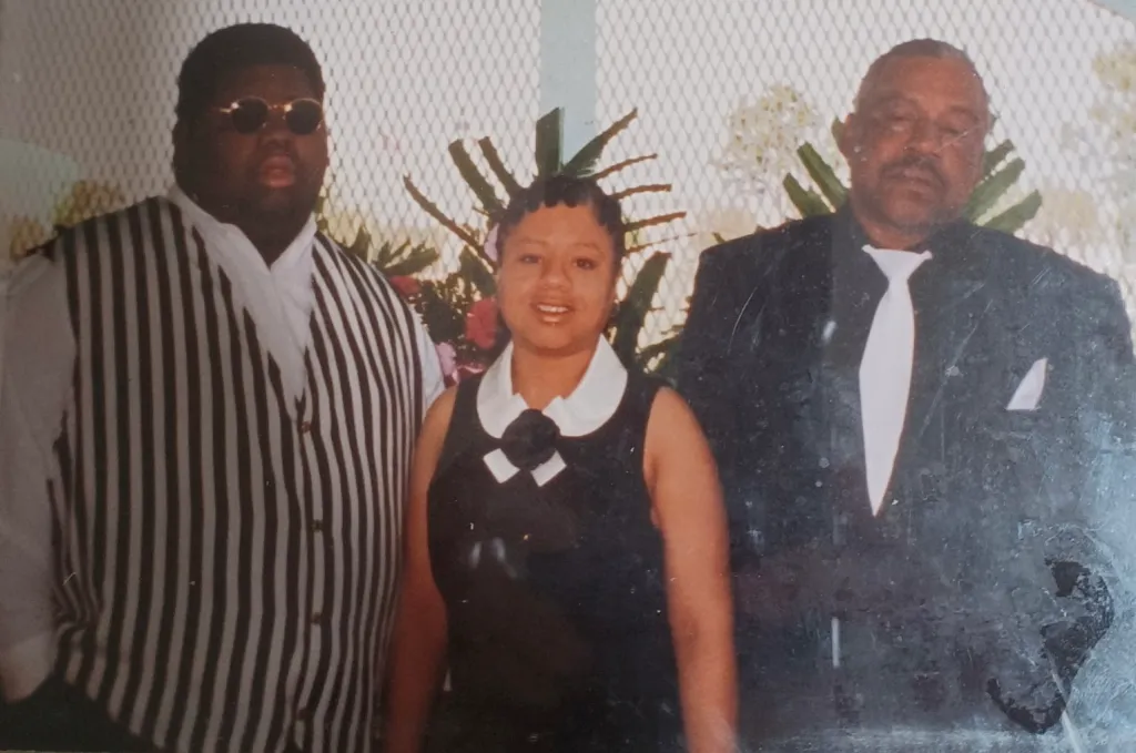 Almond Gene Little Jr., Lovetta Little-Smith, and Almond Gene Little in a group photo.