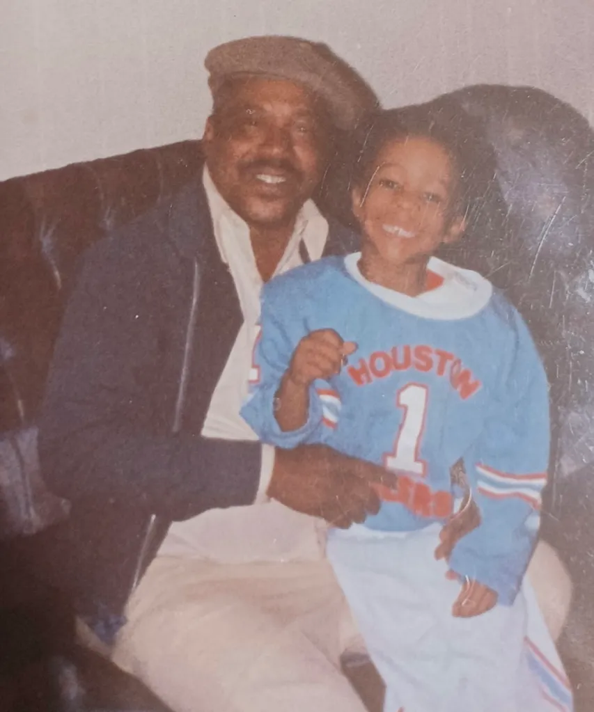 Almond Gene Little holding his daughter Lovetta Little-Smith as a child.