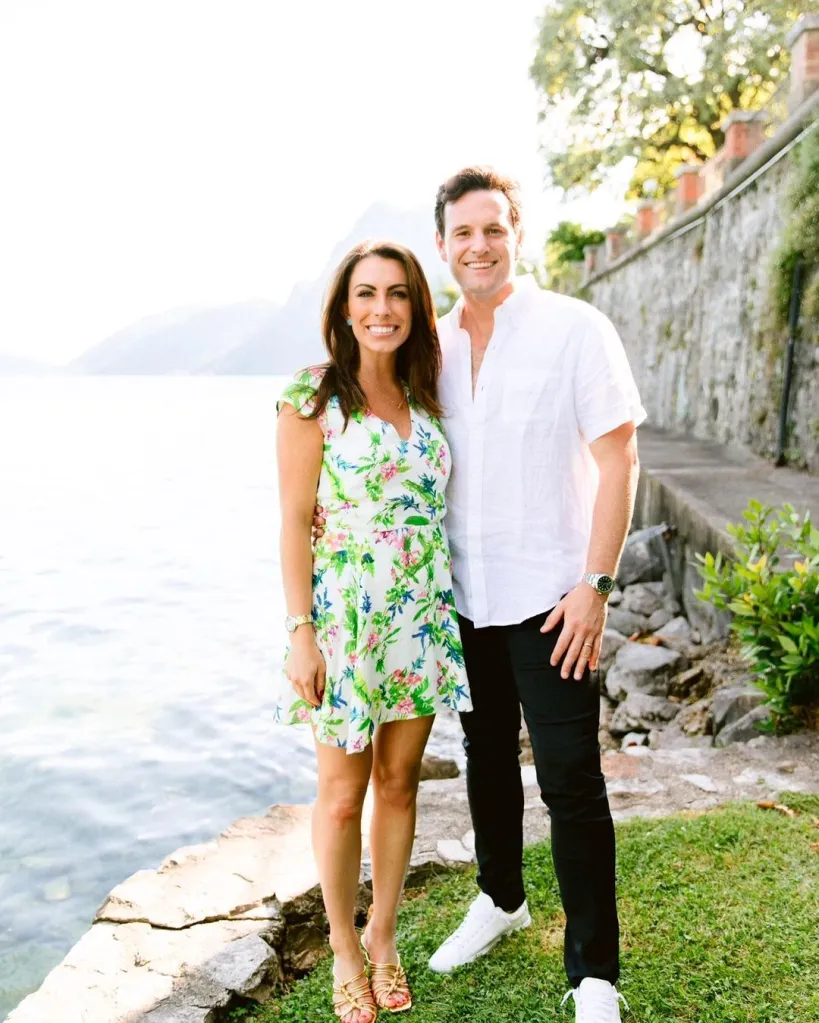 Alyssa Farrah Griffin and husband Justin smiling by a body of water.