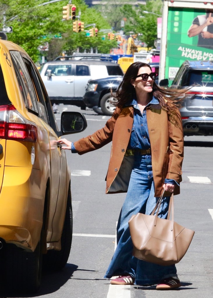 Anne Hathaway with a Brunello Cucinelli bag.