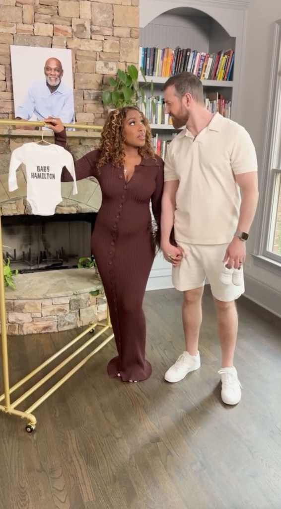 Lauren Speed and Cameron Hamilton announce they are expecting a child, Speed holding a