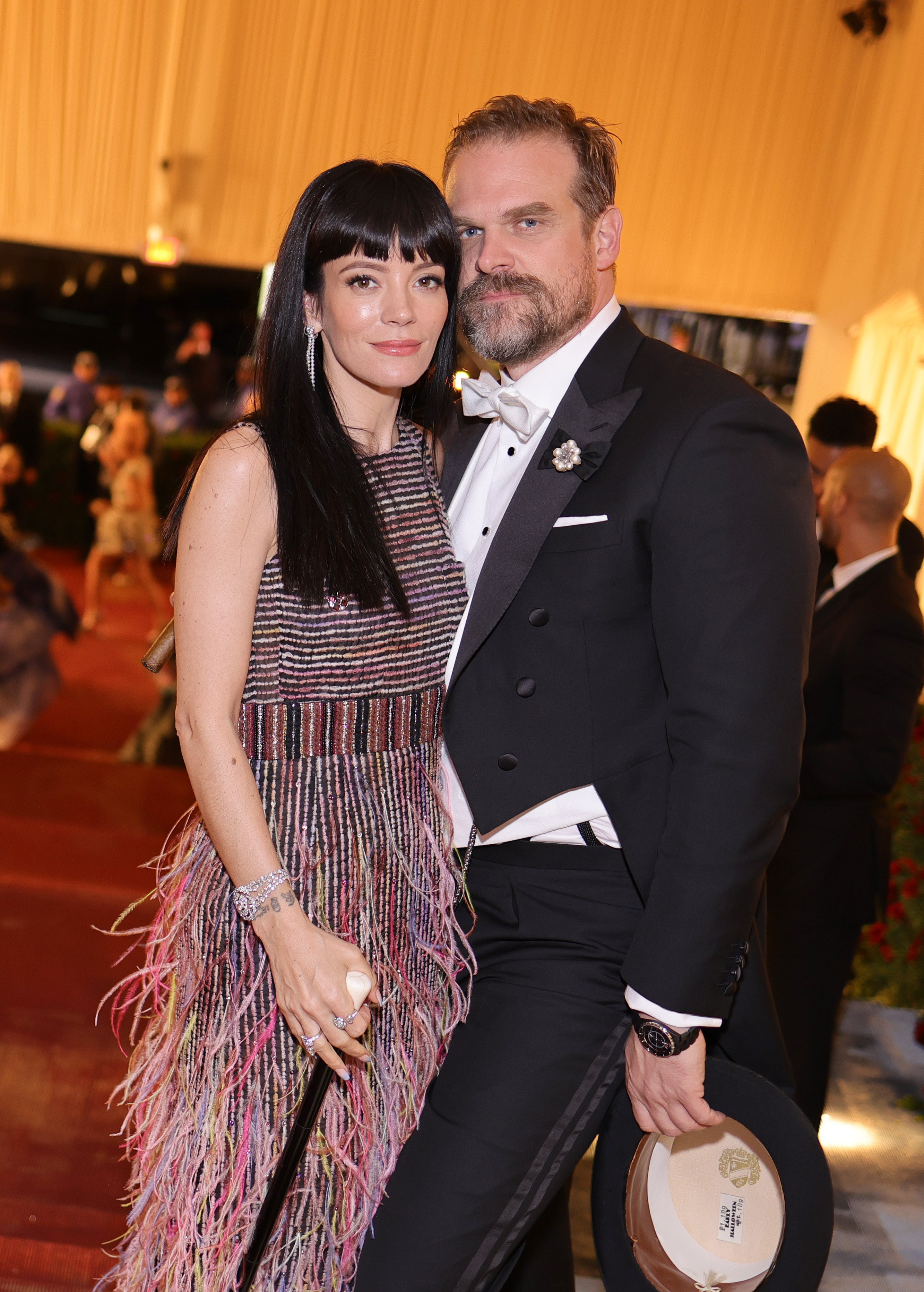 Lily Allen in a feathered gown and David Harbour in a tuxedo at the Met Gala.