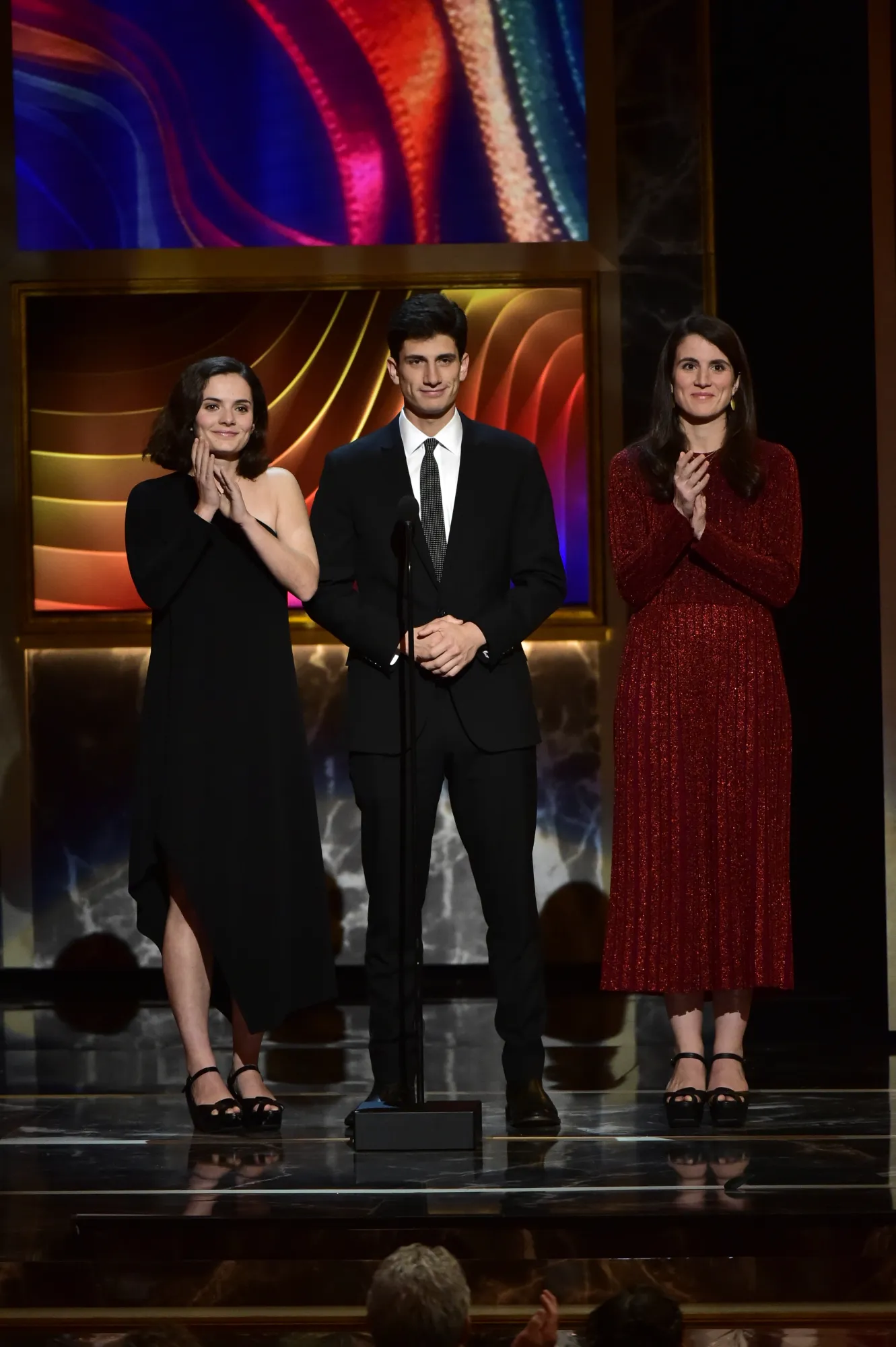 Rose Schlossberg, Jack Schlossberg, and Tatiana Schlossberg standing on stage at the 39th Annual Kennedy Center Honors.