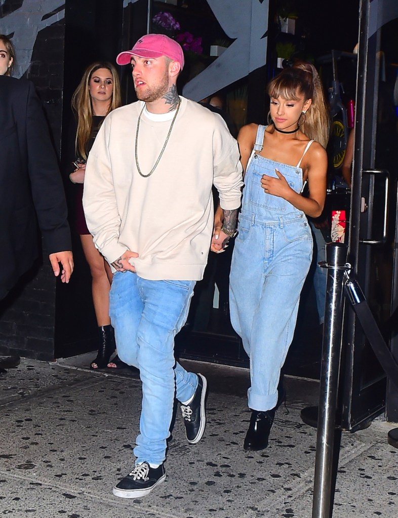 Ariana Grande and Mac Miller holding hands outside of Vandal restaurant.