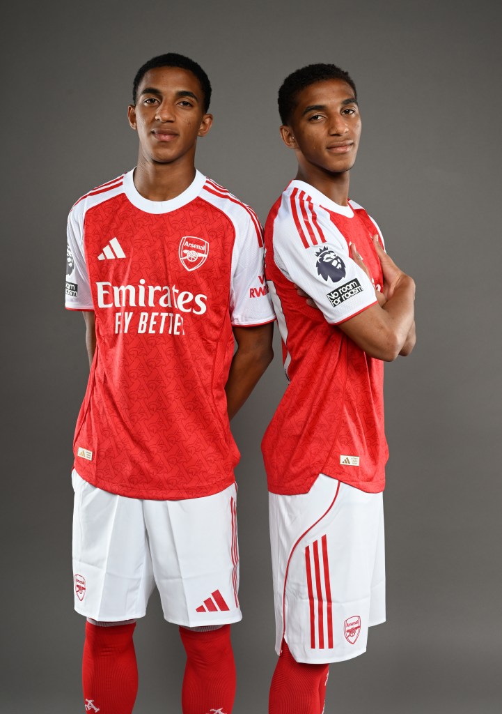 Arsenal's new signings, Edwin and Holder Quintero, posing in matching red and white team jerseys.