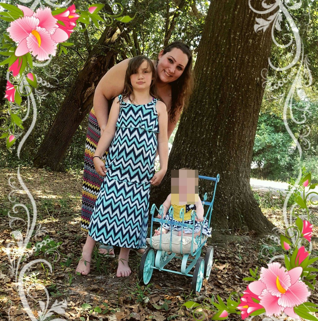 Ashley Troy is seen with daughters in an undated Facebook photo.