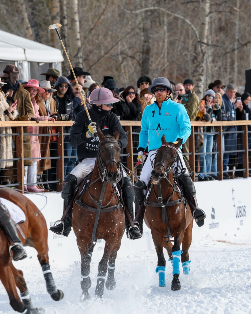 Prince Harry and Nacho Figueras playing polo in the snow.