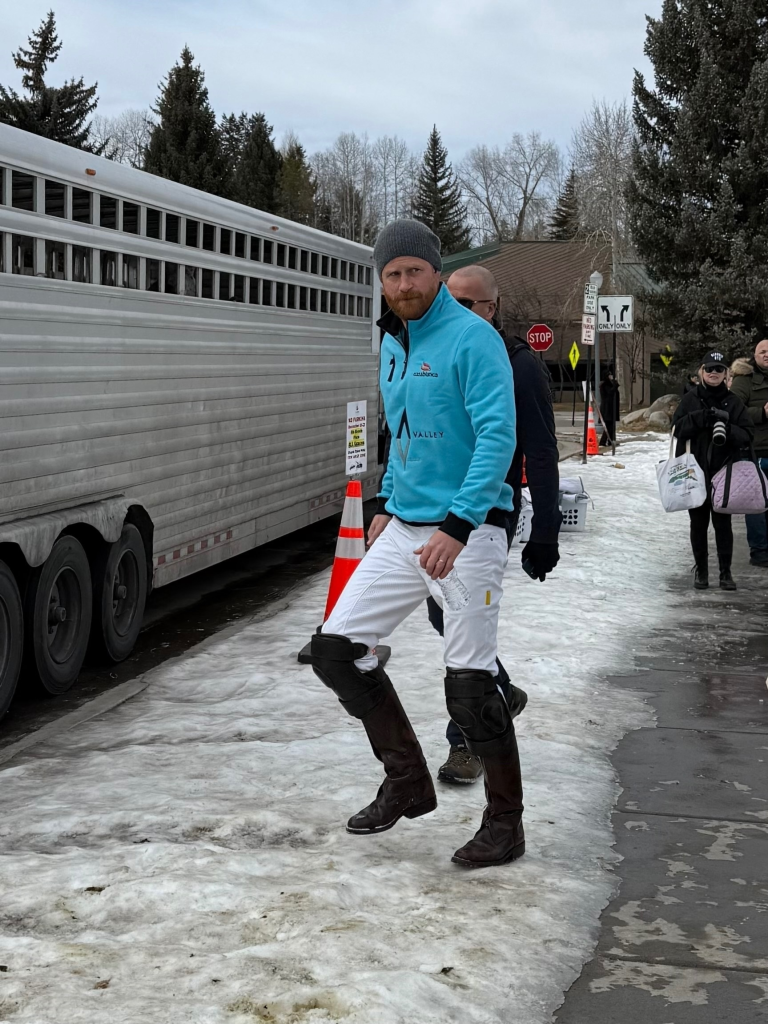 Prince Harry in polo attire walking in Aspen, Colorado.