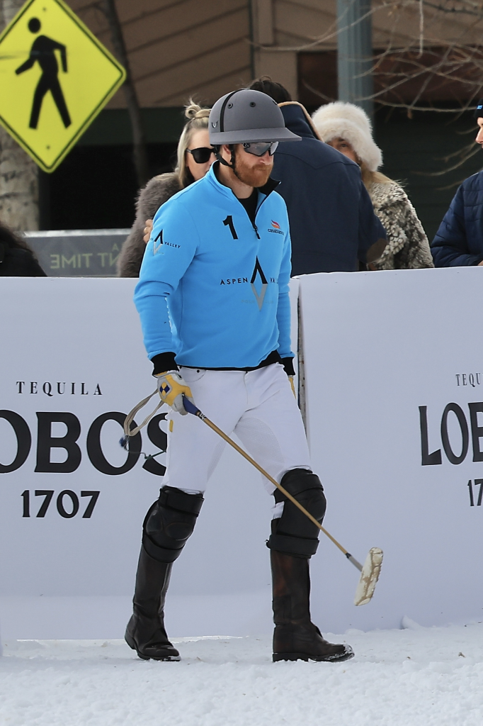 Prince Harry playing polo in Aspen, wearing a blue shirt with