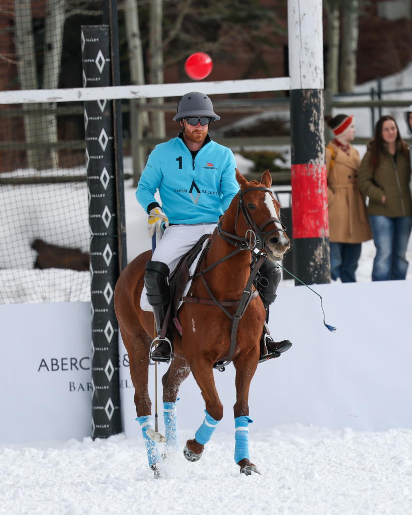 Prince Harry playing polo on horseback in Aspen.