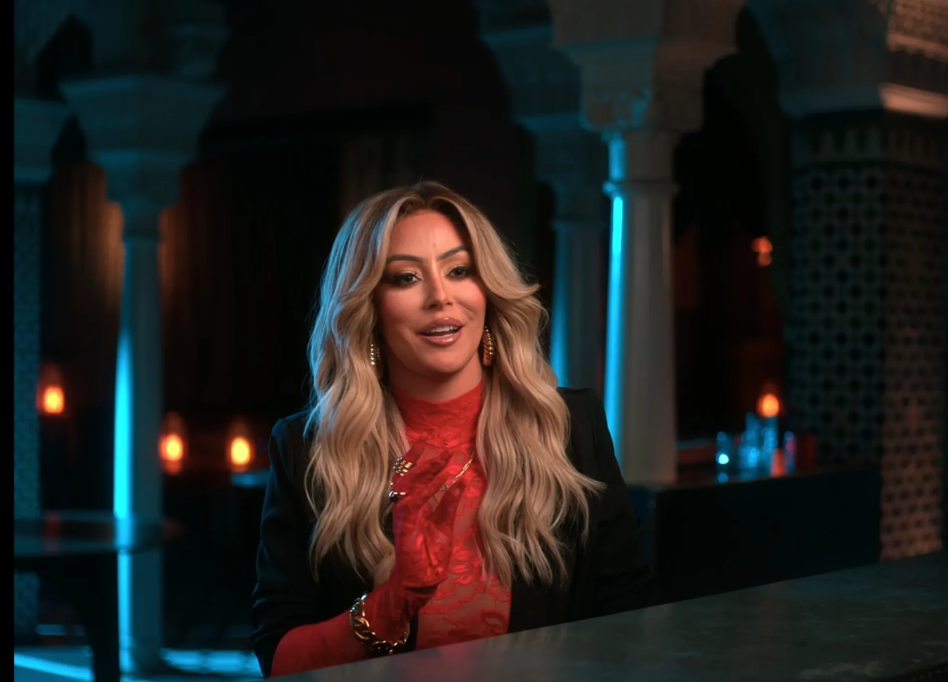 Aubrey O’Day speaking with her hands clasped.