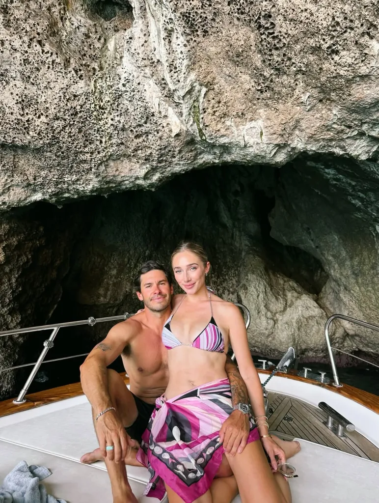 Aurora Culpo and fiance Zac on a boat near a cave.