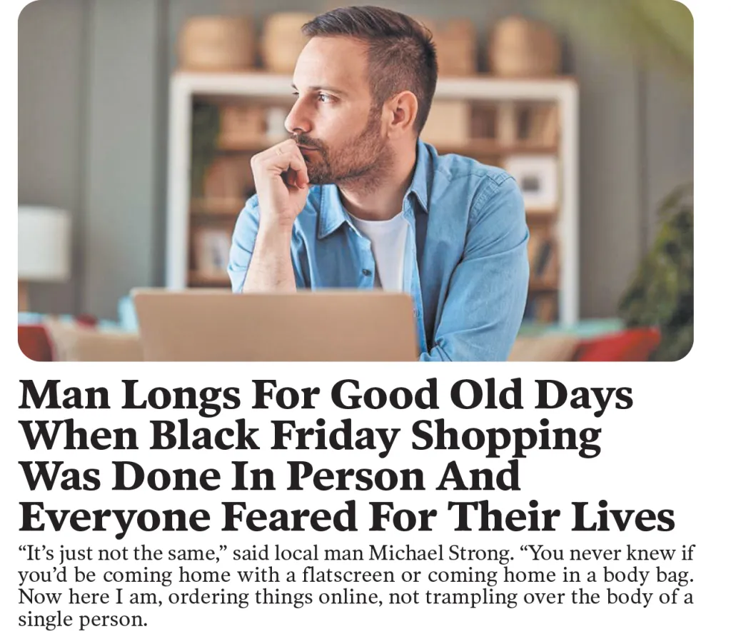 A man at his laptop looks off contemplatively, longing for the