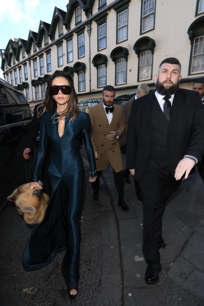 Victoria Beckham in an emerald green dress and David Beckham in a tan overcoat at the wedding of Holly Ramsay.