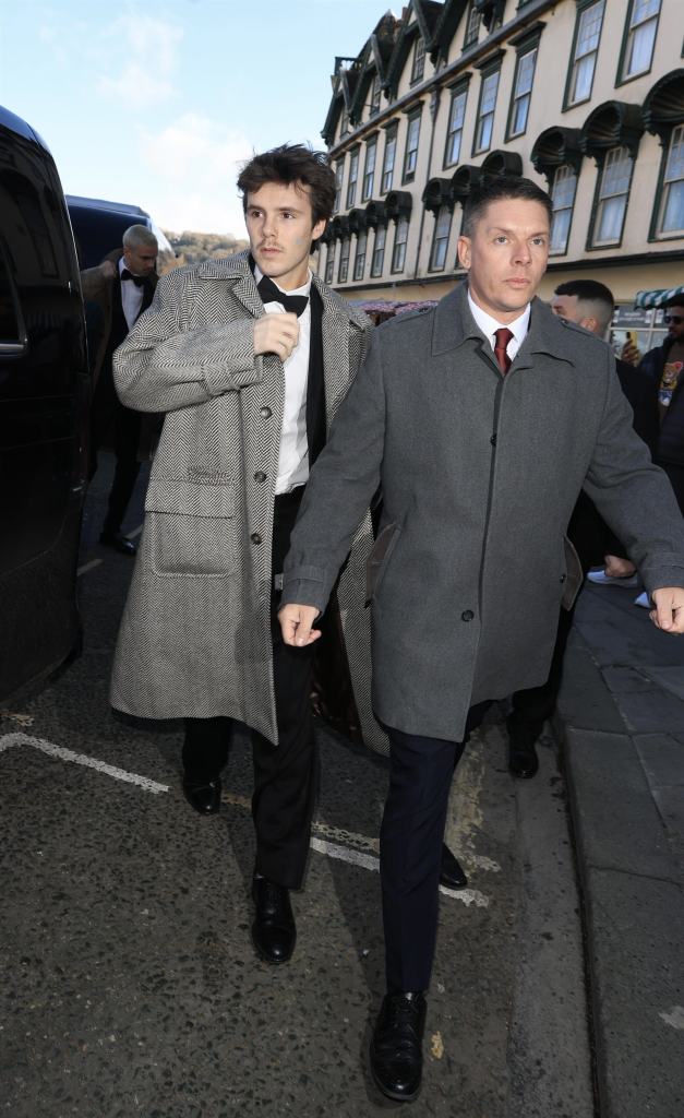 Cruz Beckham arriving at Bath Abbey for the wedding of Adam Peaty and Holly Ramsay.
