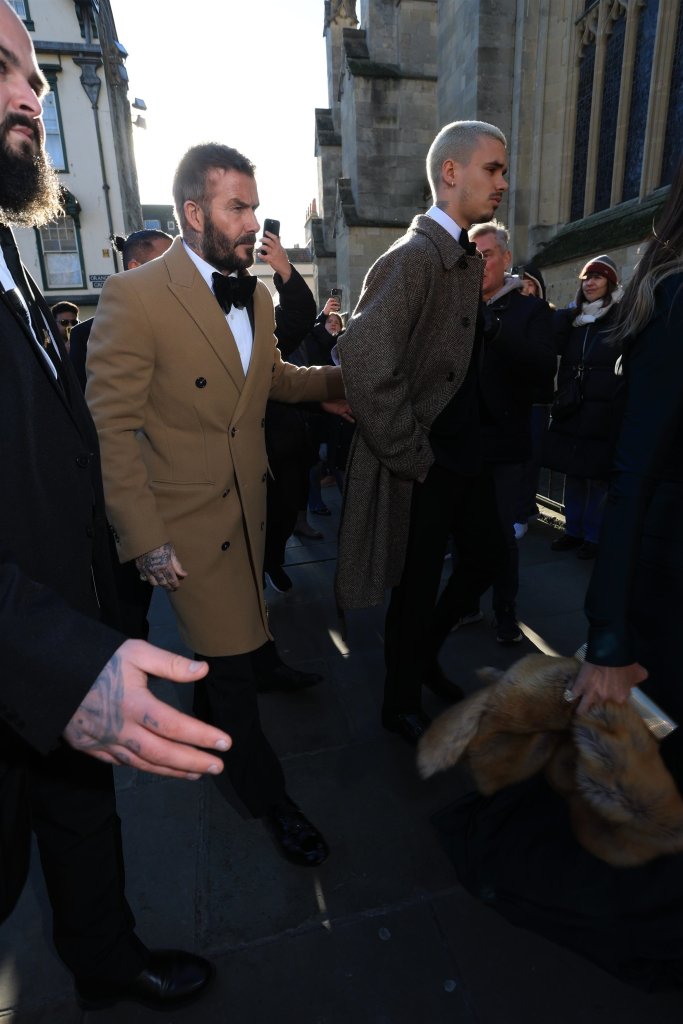 David Beckham and Romeo James Beckham arrive at Bath Abbey for the wedding of Adam Peaty and Holly Ramsay.