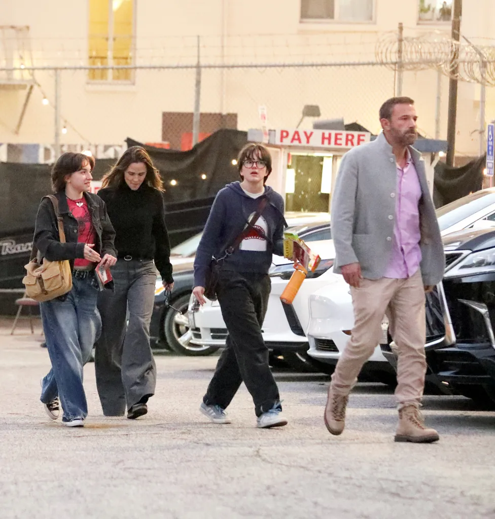 Ben Affleck, Jennifer Garner, Fin Affleck, and a friend walking outside the Pantages Theatre.