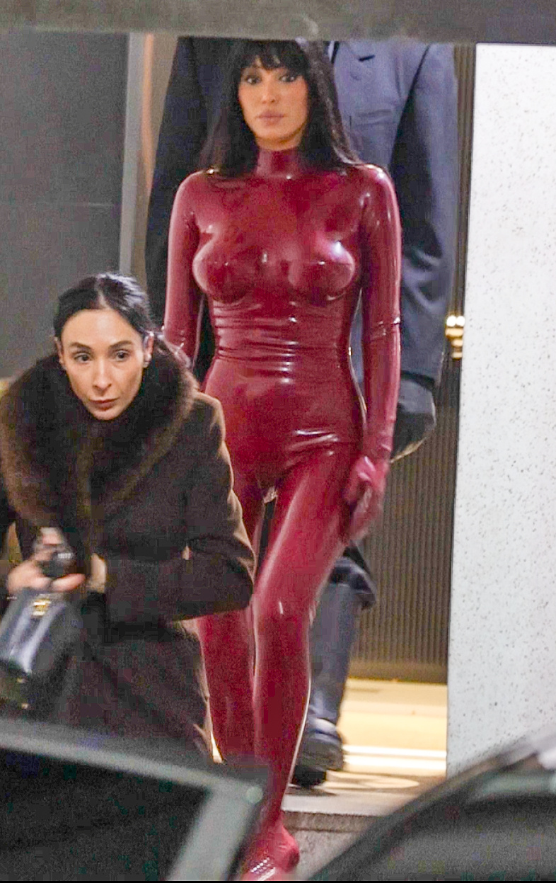Bianca Censori in a red bodysuit with Angelina Censori in a brown coat.