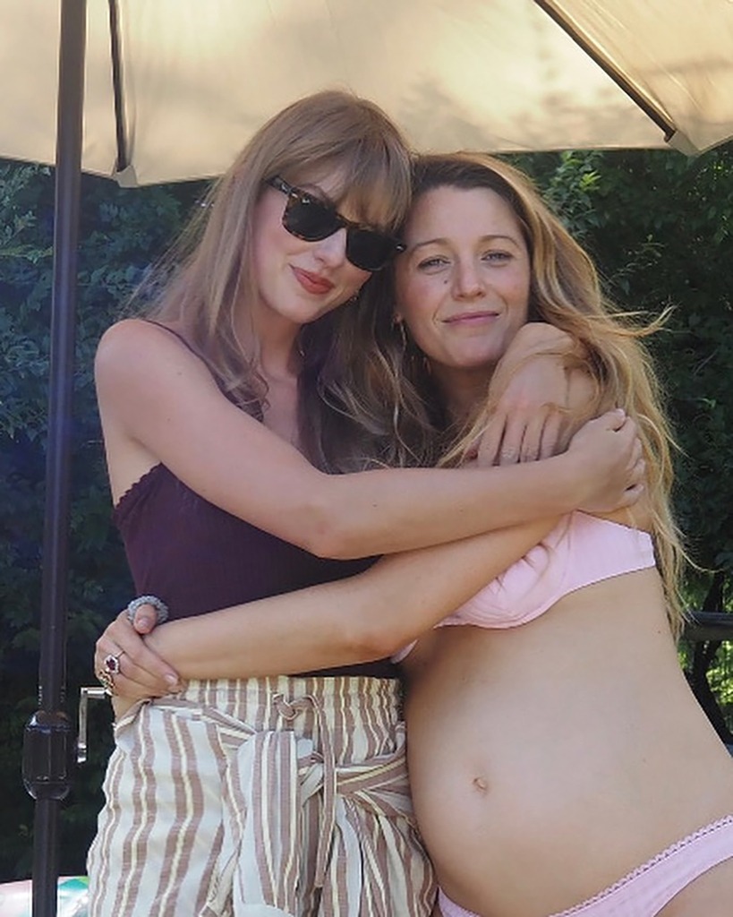 Taylor Swift hugging a pregnant Blake Lively.