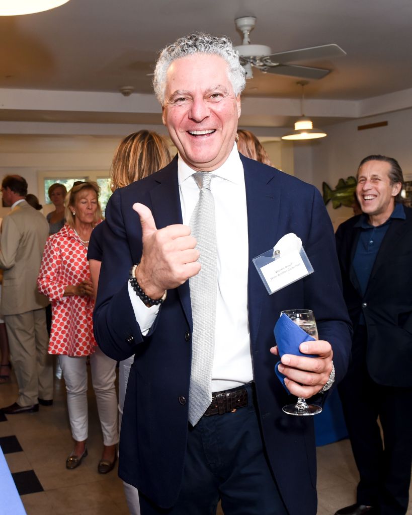 Vittorio Assaf gives a thumbs up while holding a drink at the Southampton Fresh Air Home's auction benefit gala.