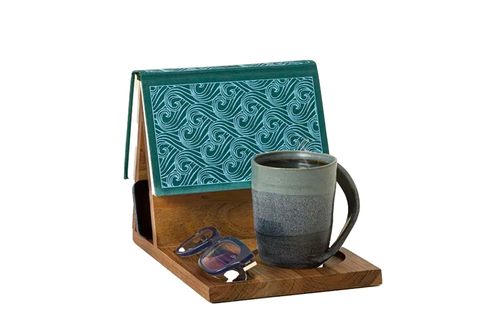 A cup and glasses on a wooden tray