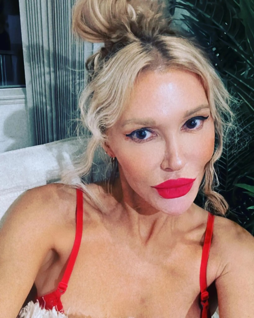 Brandi Glanville wearing a red bra.