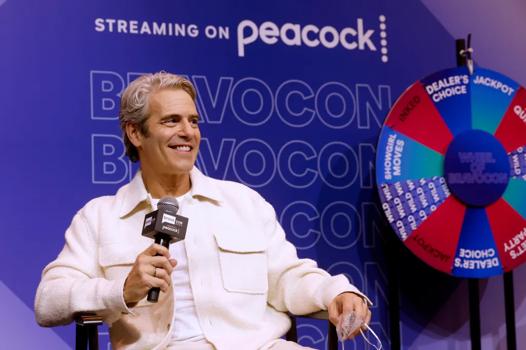 Andy Cohen speaking at a BravoCon panel, with a