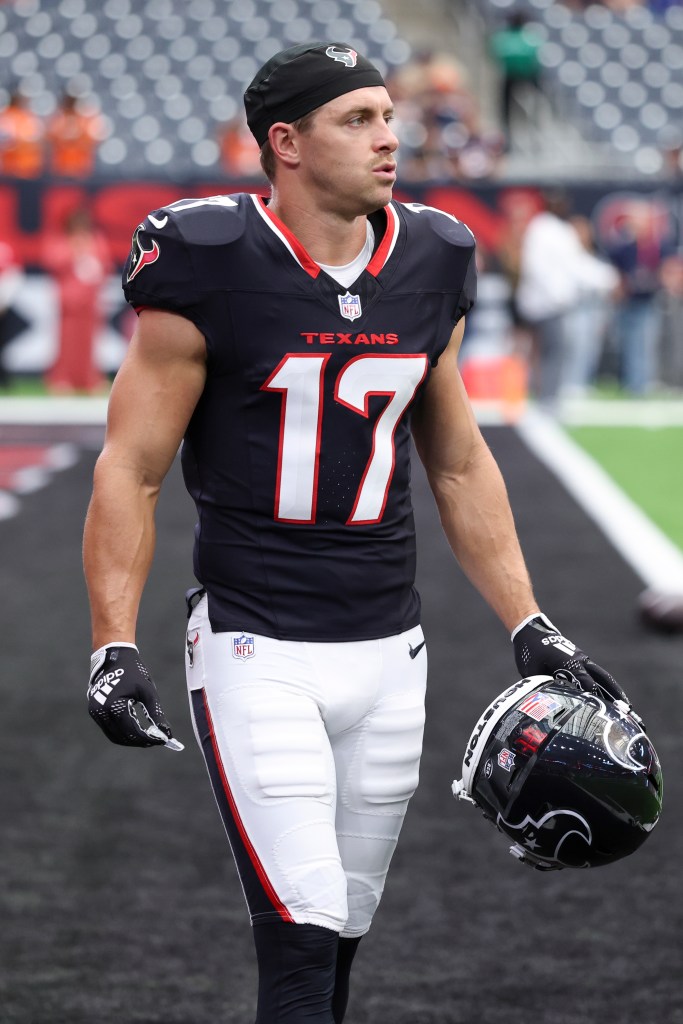 Braxton Berrios in a Houston Texans uniform with his helmet in his left hand.