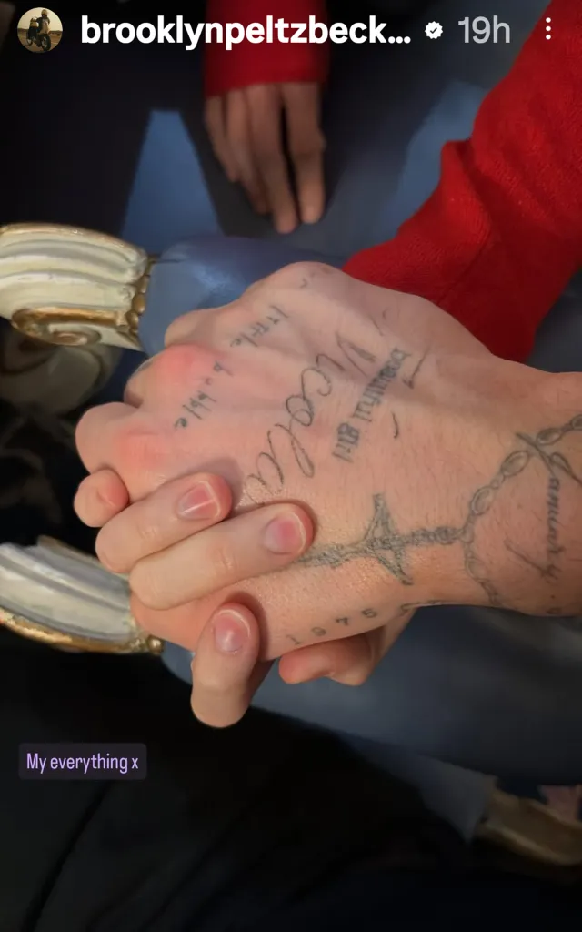 Brooklyn Beckham and Nicola Peltz holding hands.