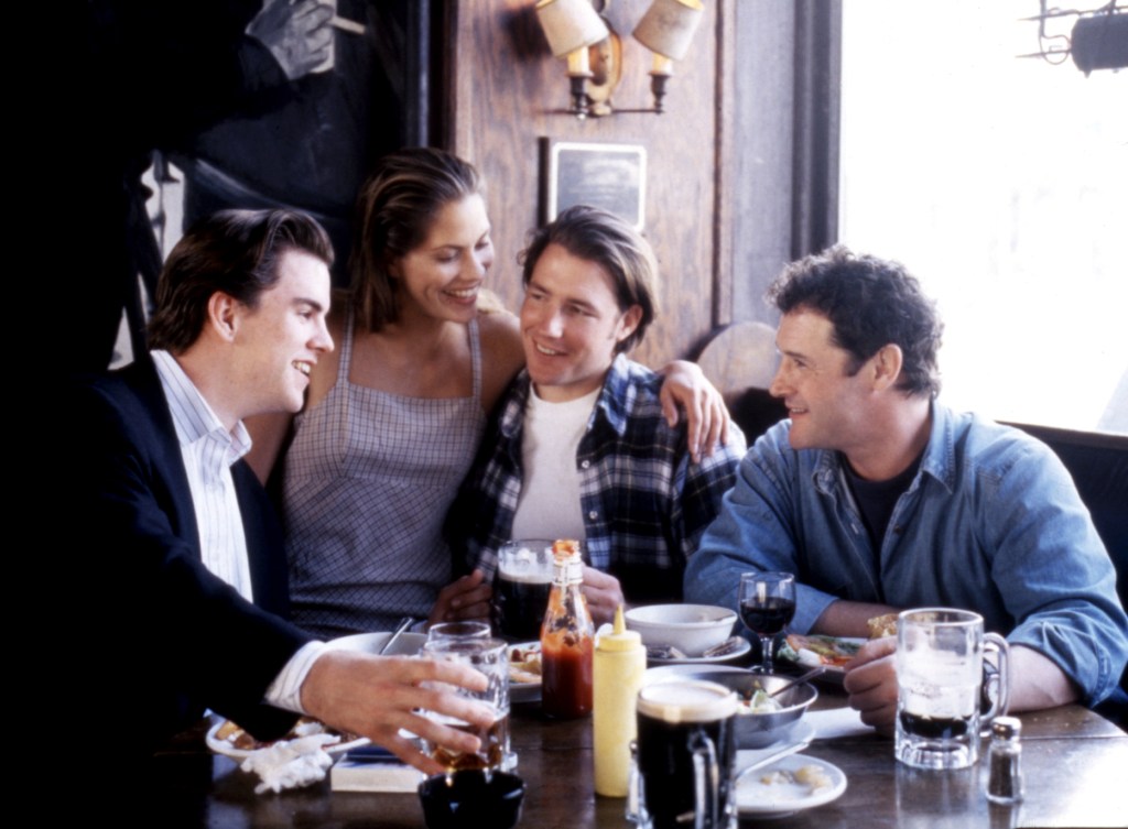 Jack Mulcahy, Maxine Bahns, Edward Burns, and Mike McGlone at a restaurant in THE BROTHERS McMULLEN.