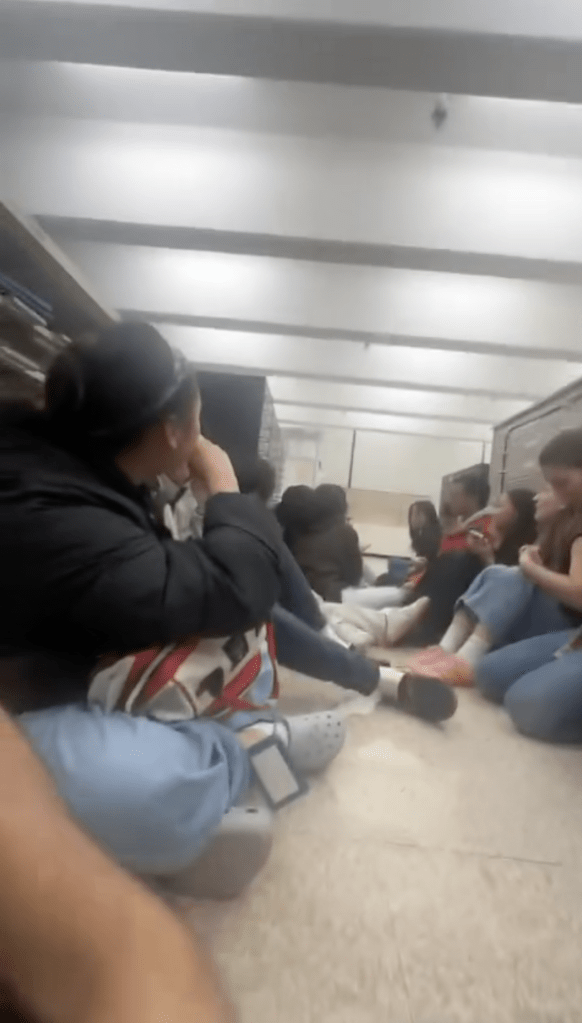 Brown students hiding from a gunman in a university library.